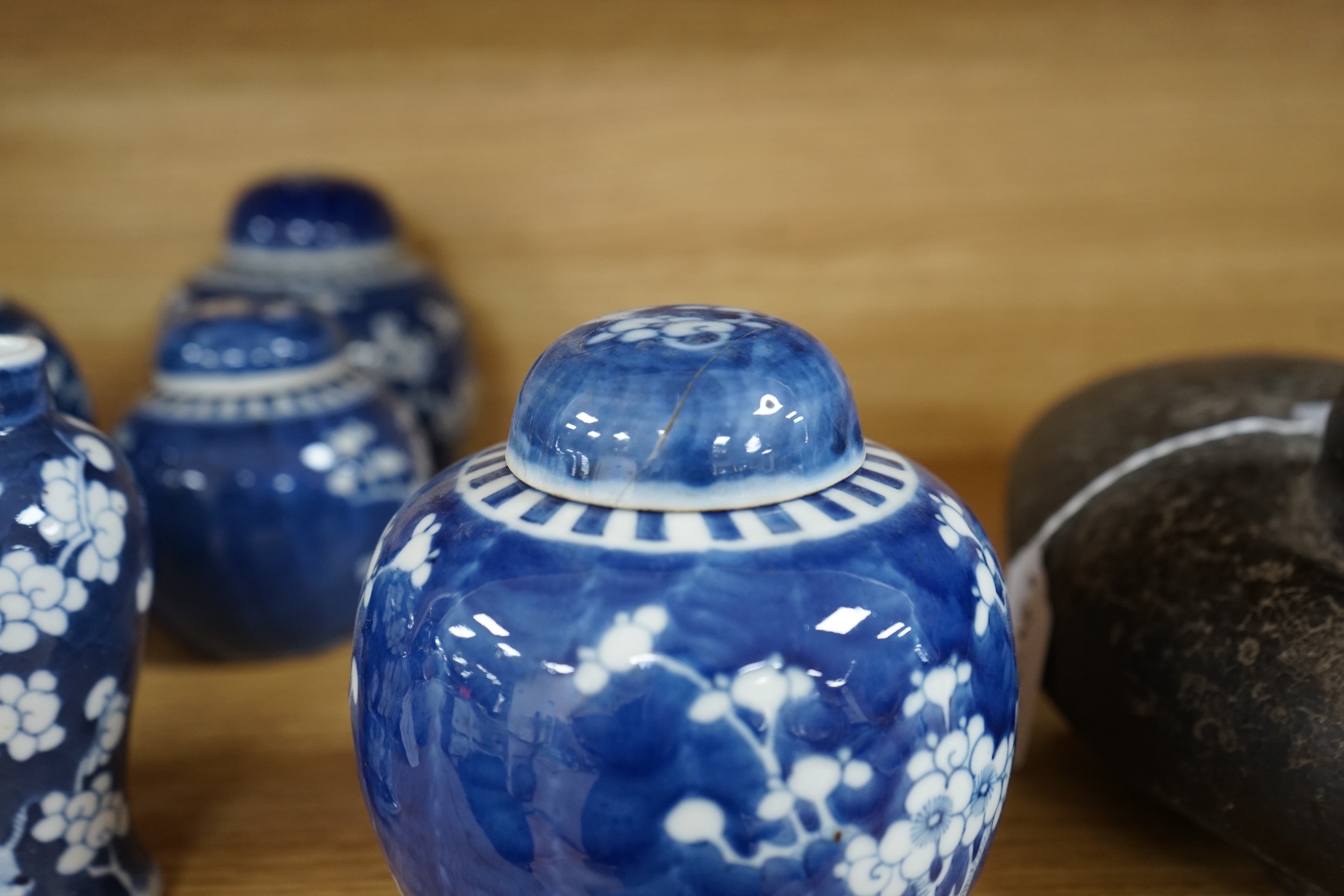 Four Chinese blue and white prunus pattern ginger jars, together with three similar vases. 19th/early 20th century, Tallest 15cm